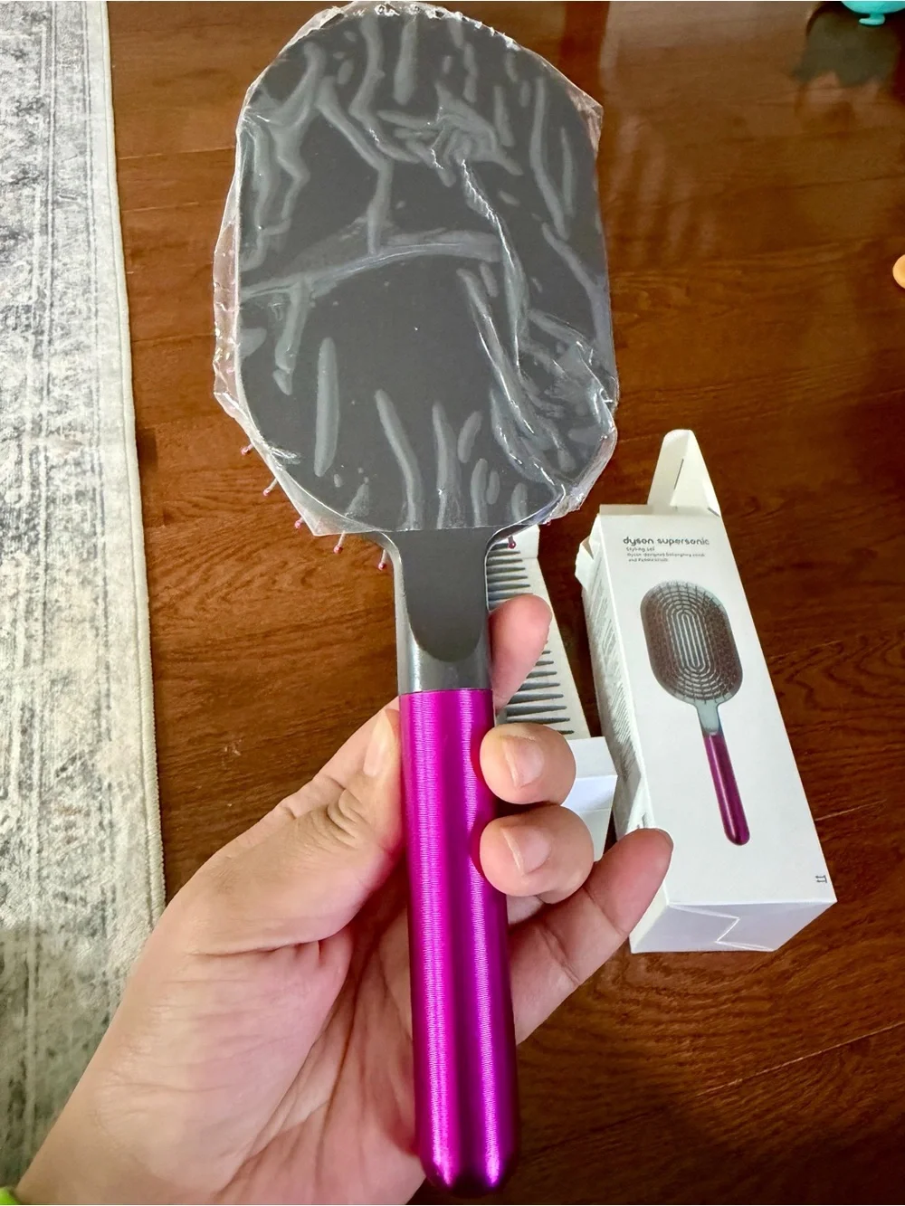 Dyson pink paddle brush with grey cushion
